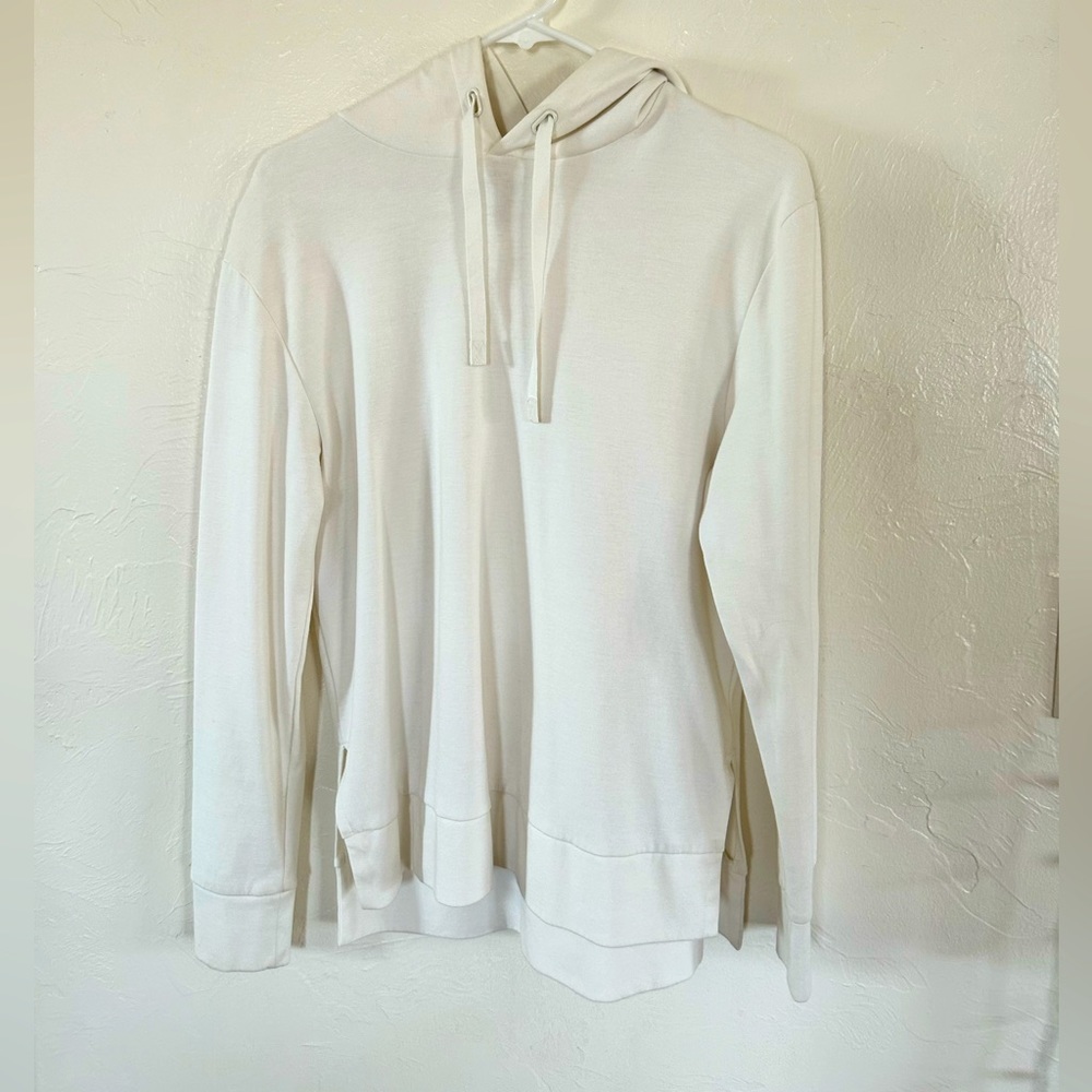 A New Day white hoodie.